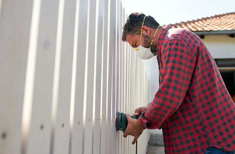 Man repairing fence